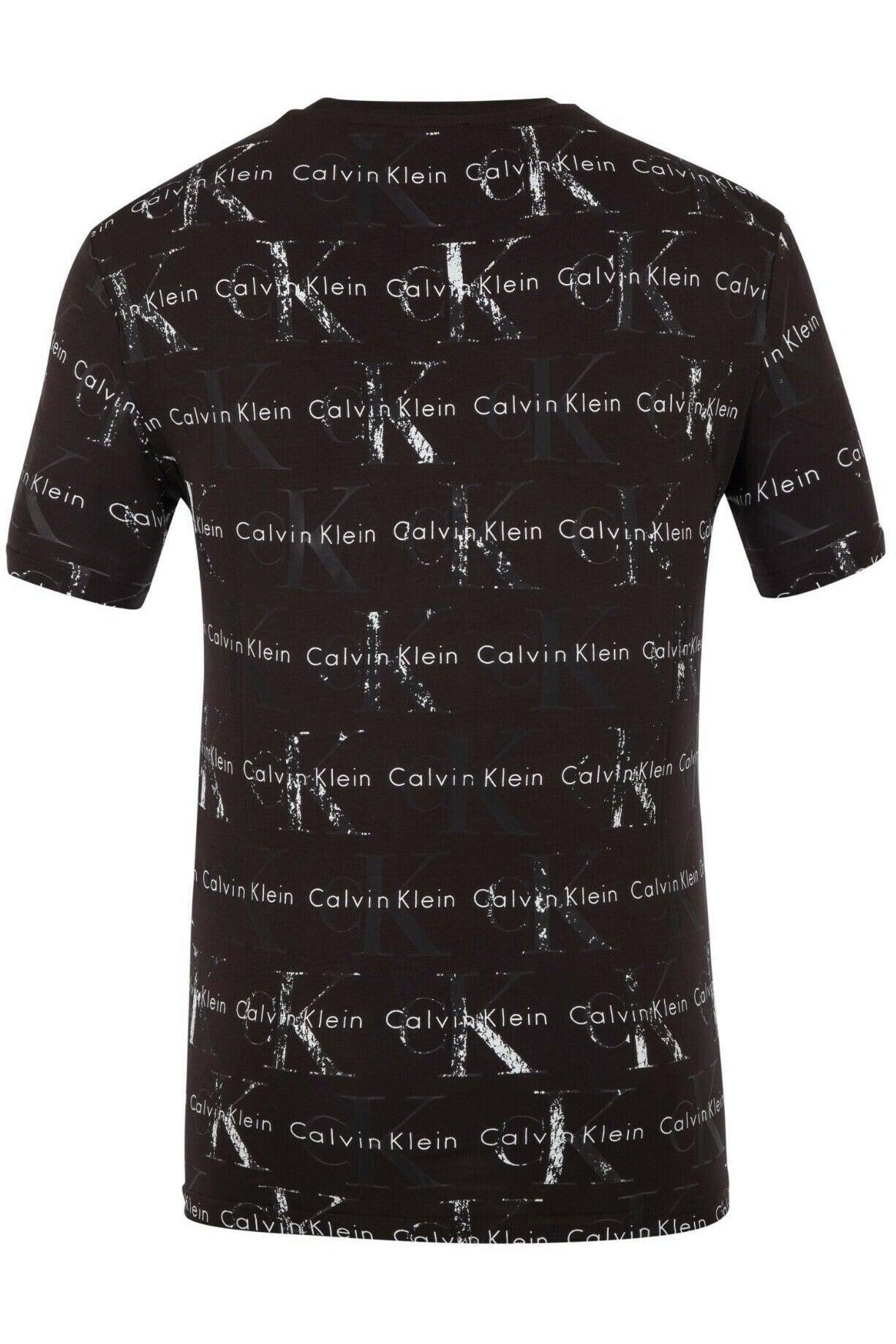 Black Calvin Klein t-shirt with repeated white and dark CK logos and Calvin Klein text pattern